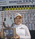 Park Inbee, of South Korea, posses with the champion's trophy after winning the LPGA North Texas Shootout golf tournament, Sunday, May 3, 2015, in Irving, Texas. (AP Photo/LM Otero)
