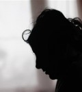 In this March 2, 2015 photo, Klara Balogova is silhouetted against a window at a Roma settlement near Kralovsky Chlmec, Slovakia. Balogova was 18, penniless and pregnant when she rode thousands of miles from Slovakia to England to marry a man she had never met. Each year, dozens of women from the poorer corners of eastern Europe are lured to travel to western Europe for sham marriages with men who pay large sums because they want to live, work or claim benefits more easily in their chosen country and move freely within Europe. (AP Photo/Petr David Josek)