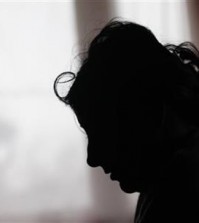 In this March 2, 2015 photo, Klara Balogova is silhouetted against a window at a Roma settlement near Kralovsky Chlmec, Slovakia. Balogova was 18, penniless and pregnant when she rode thousands of miles from Slovakia to England to marry a man she had never met. Each year, dozens of women from the poorer corners of eastern Europe are lured to travel to western Europe for sham marriages with men who pay large sums because they want to live, work or claim benefits more easily in their chosen country and move freely within Europe. (AP Photo/Petr David Josek)