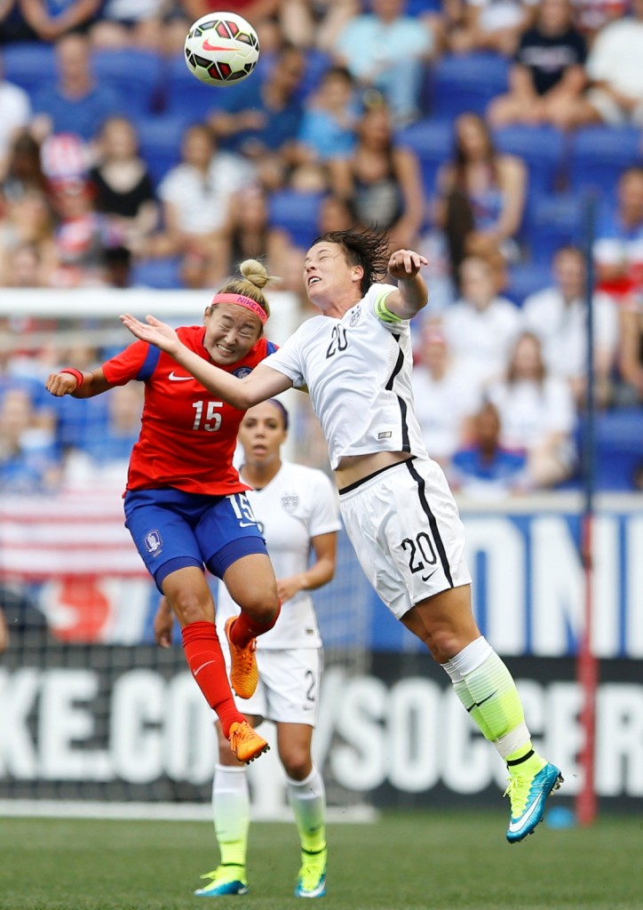 South Korea midfielder Cho Sohyun, left, and United States forward Abby Wambach (20) go up for the ball during the first half of an international friendly soccer match, Saturday, May 30, 2015, in Harrison, N.J. (AP Photo/Julio Cortez)