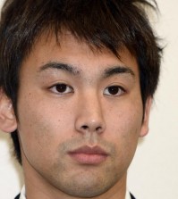 Japanese swimmer Naoya Tomita, who was suspended for stealing a camera at the Asian Games, attends a news conference in Nagaya, central Japan, Thursday, Nov. 6, 2014. Tomita has denied the allegations, claiming someone placed the camera in his gym bag. He initially admitted to stealing a camera left poolside by a South Korean reporter on Sept. 25 at the games in Incheon, South Korea. (AP Photo/Kyodo News)