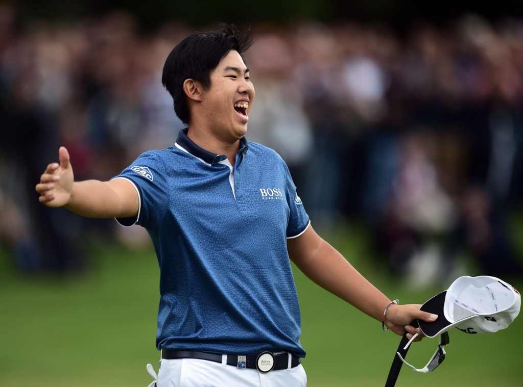 South Korea's Byeong Hun An gestures, after winning the 2015 BMW PGA Golf Championship, at the Wentworth golf club, in Virginia Water, England, Sunday May 24, 2015. (Adam Davy/PA via AP)