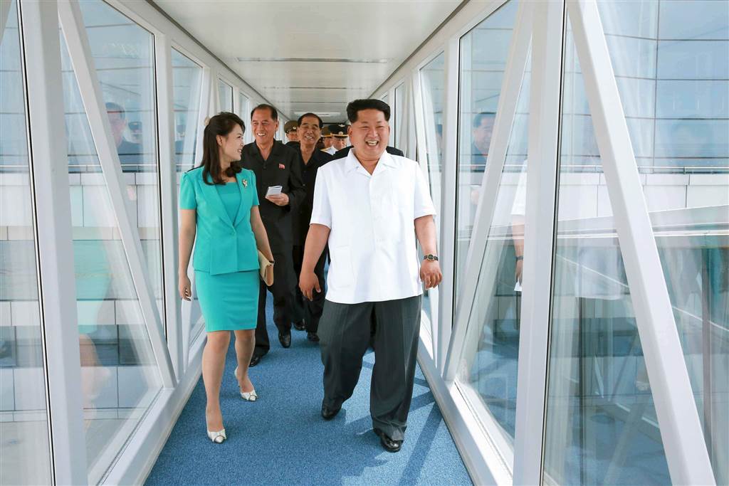 North Korean leader Kim Jong-un tours the new Pyongyang airport terminals with his wife Ri Sol-ju. (KCNA/Yonhap)