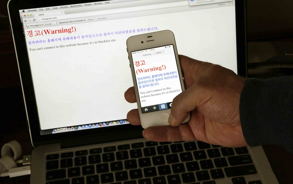 In this Saturday, June 20, 2015 photo, a notification which reads, “Warning! You can’t connect to this website because it’s in blacklist site" is seen on both a computer screen and on a smartphone screen in Pyongyang, North Korea. Warnings are appearing on Instagram accounts in North Korea that claim access to the popular photo-sharing app is being denied and the site is blacklisted for harmful content. (AP Photo/Wong Maye-E)