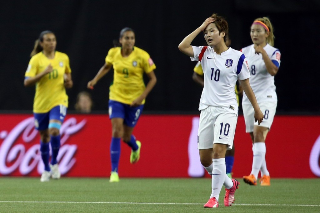 South Korea's Ji So-yun (10) reacts as Brazil scored a goal during the first half of a FIFA Women's World Cup Group E match in Montreal, Canada, on June 9, 2015. Brazil beat South Korea 2-0. (Yonhap)