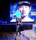 Choi "PoLt" Seong-hun walks off stage after an e-sports championship match. (AP Photo/David Goldman)