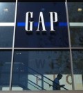 FILE - In this Feb. 26, 2013, file photo, a shopper walks down the steps at a Gap store in Los Angeles. Gap Inc., which owns Gap, Old Navy and Banana Republic, said Monday, June 15, 2015, it will close about 140 Gap stores in North America in the fiscal year that ends Jan. 31. (AP Photo/Jae C. Hong, File)