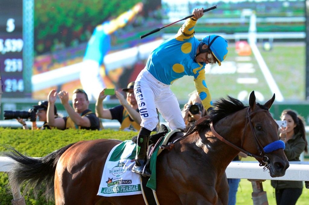 Victor Espinoza reacts after crossing the finish line with American Pharoah (5) to win the 147th running of the Belmont Stakes horse race at Belmont Park, Saturday, June 6, 2015, in Elmont, N.Y. American Pharoah is the first horse to win the Triple Crown since Affirmed won it in 1978.(AP Photo/Bill Kostroun)