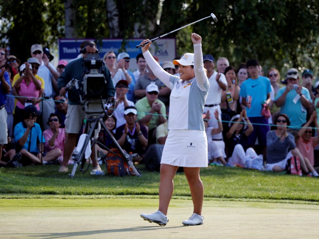 Inbee Park, of South Korea, celebrates after winning the KPMG Women's PGA golf championship at Westchester Country Club in Harrison, N.Y., Sunday, June 14, 2015. (AP Photo/Julio Cortez)