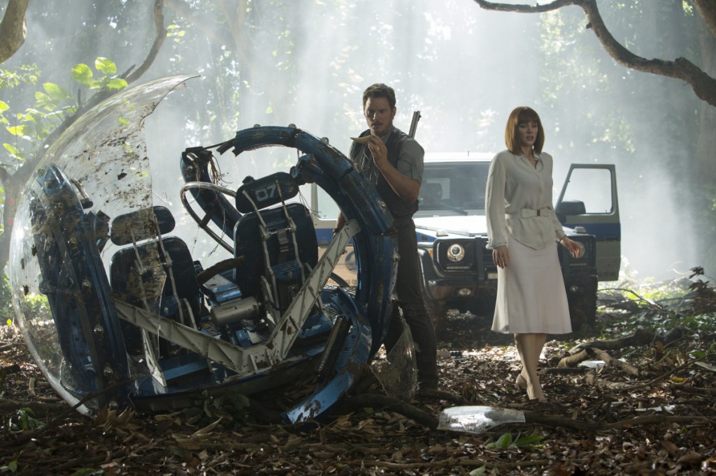 This photo provided by Universal Pictures shows, Chris Pratt, left, and Bryce Dallas Howard in a scene from the film, "Jurassic World," directed by Colin Trevorrow, in the next installment of Steven Spielberg's groundbreaking "Jurassic Park" series. The 3D movie releases in theaters by Universal Pictures on June 12, 2015. (Chuck Zlotnick/Universal Pictures via AP)