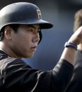 Pittsburgh Pirates shortstop Jung Ho Kang, of South Korea, gestures to teammates during batting practice before the Pirates play the San Diego Padres in a baseball game Friday, May 29, 2015, in San Diego. (AP Photo/Gregory Bull)