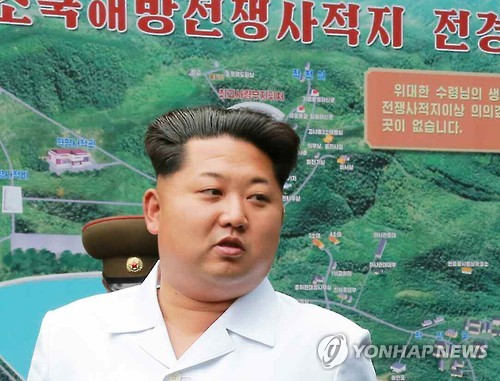 Kim Jong-un shows up in a public appearance with what look like white and gray hairs. (Yonhap)