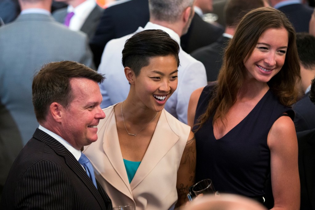 Top Chef winner Kristen Kish, center, and her girlfriend Jacqueline Westbrook, right, pose for photos during a reception to celebrate LGBT Pride Month in the East Room of the White House, on Wednesday, June 24, 2015, in Washington. (AP Photo/Evan Vucci)