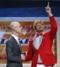 D’Angelo Russell, right, gestures upward as he is greeted by NBA Commissioner Adam Silver after the Los Angeles Lakers selected Russell with the second pick in the NBA basketball draft, Thursday, June 25, 2015, in New York. (AP Photo/Kathy Willens)