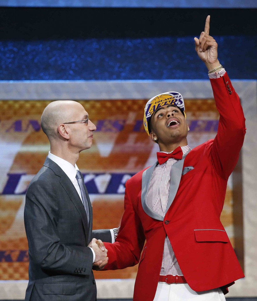 D’Angelo Russell, right, gestures upward as he is greeted by NBA Commissioner Adam Silver after the Los Angeles Lakers selected Russell with the second pick in the NBA basketball draft, Thursday, June 25, 2015, in New York. (AP Photo/Kathy Willens)