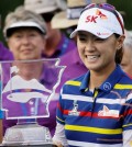 Na Yeon Choi, of South Korea, holds trophy after winning the NW Arkansas Championship LPGA golf tournament at Pinnacle Country Club in Rogers, Ark., Sunday, June 28, 2015. (AP Photo/Danny Johnston)