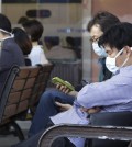 South Koreans wearing masks against the possible Middle East Respiratory Syndrome virus sit at the emergency room at Seoul National University Hospital in Seoul, South Korea, Monday, June 1, 2015. More than 680 people in South Korea are isolated after having contact with patients infected with a virus that has killed hundreds of people in the Middle East, health officials said Monday.(AP Photo/Ahn Young-joon)