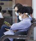 South Koreans wearing masks against the possible Middle East Respiratory Syndrome virus sit at the emergency room at Seoul National University Hospital in Seoul, South Korea, Monday, June 1, 2015. More than 680 people in South Korea are isolated after having contact with patients infected with a virus that has killed hundreds of people in the Middle East, health officials said Monday.(AP Photo/Ahn Young-joon)