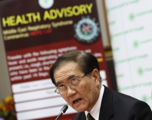 Public Health Minister Rajata Rajatanavin talks to reporters during press conference in Bangkok, Thailand Thursday, June 18, 2015. Thailand says it has confirmed its first known case of the deadly MERS virus, a man who arrived from a Middle Eastern country for treatment of a heart condition. (AP Photo/Sakchai Lalit)
