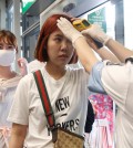 Passengers flying from Busan, South Korea, receive temperature checks for MERS (Middle East Respiratory Syndrome) as they arrive at Hong Kong Airport, Friday, June 5, 2015. The current frenzy in South Korea over MERS brings to mind the other menacing diseases to hit Asia over the last decade — SARS, which killed hundreds, and bird flu. (AP Photo/Kin Cheung)
