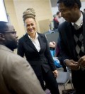 FILE - In this Friday, Jan. 16, 2015, file photo, Rachel Dolezal, center, Spokane's newly-elected NAACP president, smiles as she meets with Joseph M. King, of King's Consulting, left, and Scott Finnie, director and senior professor of Eastern Washington University's Africana Education Program, before the start of a Black Lives Matter Teach-In on Public Safety and Criminal Justice, at EWU, in Cheney, Wash. Dolezal's family members say she has falsely portrayed herself as black for years. (Tyler Tjomsland/The Spokesman-Review via AP, File)