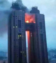 In this photo, exclusively obtained and released on June 12, 2015 by local radio station BBS, black smoke and flames billow from a bridge between the 43rd floors of Koryo Hotel in the North Korean capital of Pyongyang on the previous day. The fire had broken out at the hotel frequented by foreigners, without any information being provided on casualties or property damage, reports said on June 12, 2015. The fire appears to have been extinguished, according to The Associated Press. (Yonhap)