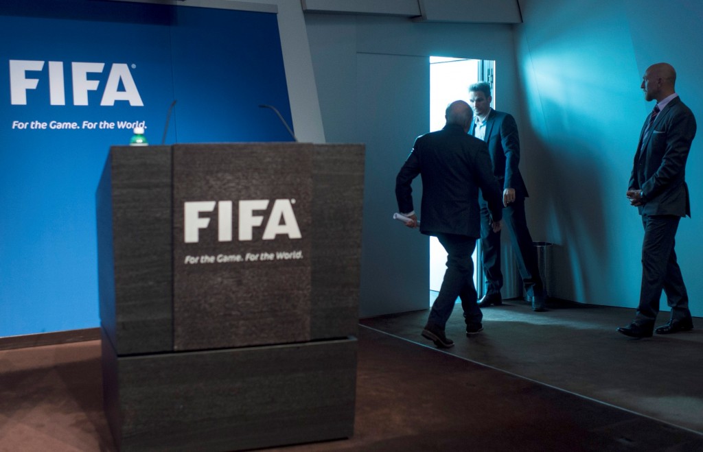 FIFA President Sepp Blatter leaves after speaking at a press conference at the FIFA headquarters in Zurich, Switzerland, Tuesday, June 2, 2015. Sepp Blatter says he will resign from his position amid corruption scandal and is promising to call for fresh elections to choose a successor. (Ennio Leanza/Keystone via AP)