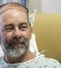 In this photo taken on Wednesday, June 3, 2015, James Boysen is interviewed in his hospital bed at Houston Methodist Hospital in Houston. Texas doctors say he received the world's first skull and scalp transplant from a human donor to help heal a large head wound from cancer treatment. (AP Photo/Pat Sullivan)
