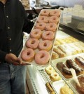 FILE - In this April 26, 2011 file photo, doughnuts are displayed in Chicago. There are a lot fewer trans fats in the nation?s food than there were a decade ago, but the Obama administration is moving toward getting rid of them almost entirely. The Food and Drug Administration says Americans still eat about a gram of trans fat every day, and phasing it out could prevent 20,000 heart attacks and 7,000 deaths each year. (AP Photo/M. Spencer Green, File)