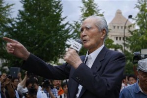 Japan's former Prime Minister Tomiichi Murayama speaks during a rally in front of the National Diet building in Tokyo, Thursday, July 23, 2015. Protesters gathered outside parliament, opposing a set of controversial bills intended to expand Japan’s defense role at home and internationally. (AP Photo/Shizuo Kambayashi)