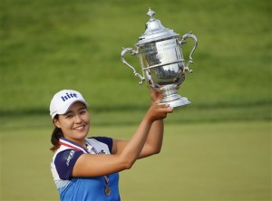 South Korea's In Gee Chun holds up the championship trophy after winning the U.S. Women's Open golf tournament at Lancaster Country Club, Sunday, July 12, 2015 in Lancaster, Pa. Chun won by one stroke over second place finisher Amy Yang.(AP Photo/Gene J. Puskar)