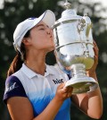 South Korea's Chun In Gee kisses the championship trophy after winning the U.S. Women's Open golf tournament at Lancaster Country Club, Sunday, July 12, 2015 in Lancaster, Pa. Chun won by one stroke over second place finisher Amy Yang. (AP Photo/Gene J. Puskar)