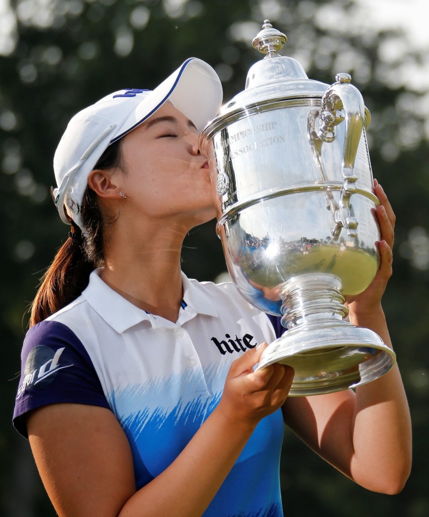 South Korea's Chun In Gee kisses the championship trophy after winning the U.S. Women's Open golf tournament at Lancaster Country Club, Sunday, July 12, 2015 in Lancaster, Pa. Chun won by one stroke over second place finisher Amy Yang. (AP Photo/Gene J. Puskar)