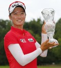 Chella Choi, of South Korea, holds her trophy after winning the Marathon Classic golf tournament on the first playoff hole at Highland Meadows Golf Club in Sylvania, Ohio, Sunday, July 19, 2015. (Yonhap/AP Photo/Rick Osentoski)