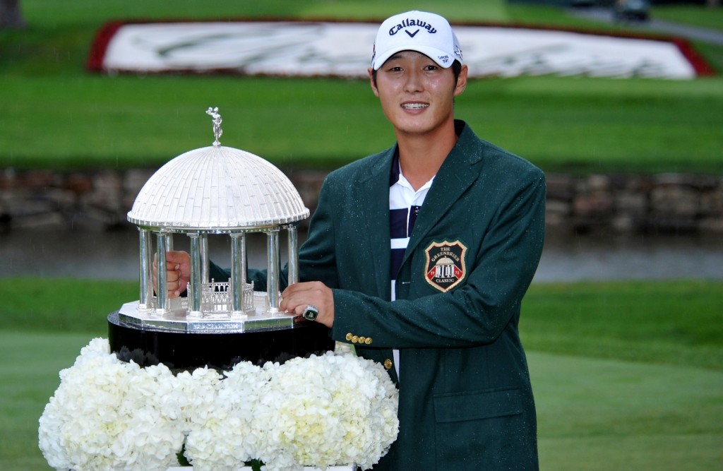Danny Lee poses with the trophy after winning the Greenbrier Classic golf tournament at Greenbrier Resort in White Sulphur Springs, W.Va., Sunday, July 5, 2015. (AP Photo/Chris Tilley)