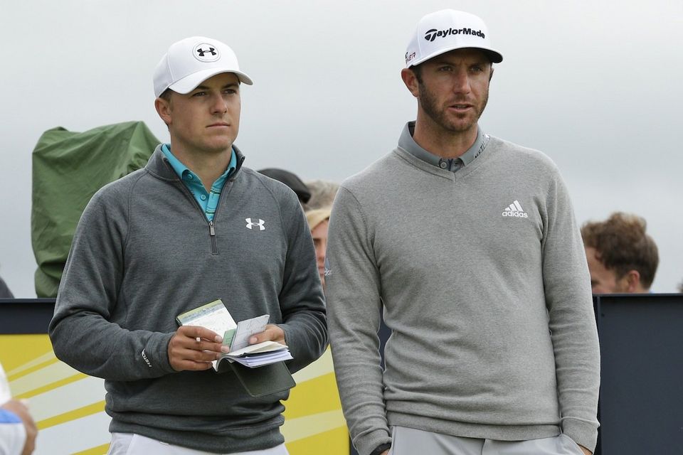United States’ Jordan Spieth, left, and United States’ Dustin Johnson speak before playing from the 15th tee during the first round of the British Open Golf Championship at the Old Course, St. Andrews, Scotland, Thursday, July 16, 2015. (AP Photo/David J. Phillip)