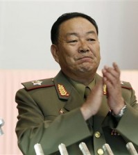 This July 18, 2012, file photo shows Vice Marshal Hyon Yong-chol applauding during a meeting announcing North Korean leader Kim Jong-un's new title of marshal, in Pyongyang, North Korea. North Korea has officially confirmed the purging of its defense chief two months after Seoul's spy service said he had been executed for disloyalty to leader Kim Jong-un, a South Korean official said Monday, July 12, 2015. South Korea's National Intelligence Service told lawmakers in May that People's Armed Forces Minister Hyon Yong-chol was killed by anti-aircraft gunfire for talking back to Kim, complaining about his policies and sleeping during a meeting. (AP Photo/Jon Chol Jin, File)