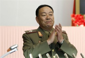 This July 18, 2012, file photo shows Vice Marshal Hyon Yong-chol applauding during a meeting announcing North Korean leader Kim Jong-un's new title of marshal, in Pyongyang, North Korea. North Korea has officially confirmed the purging of its defense chief two months after Seoul's spy service said he had been executed for disloyalty to leader Kim Jong-un, a South Korean official said Monday, July 12, 2015. South Korea's National Intelligence Service told lawmakers in May that People's Armed Forces Minister Hyon Yong-chol was killed by anti-aircraft gunfire for talking back to Kim, complaining about his policies and sleeping during a meeting. (AP Photo/Jon Chol Jin, File)