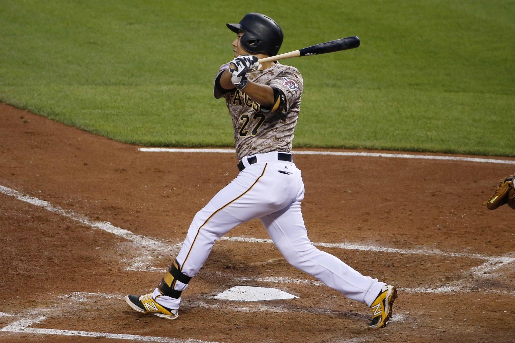 Pittsburgh Pirates' Jung Ho Kang drives in a run with a triple off Washington Nationals starting pitcher Doug Fister during the fifth inning of a baseball game in Pittsburgh, Thursday, July 23, 2015. (AP Photo/Gene J. Puskar)