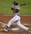 Pittsburgh Pirates' Jung Ho Kang drives in a run with a triple off Washington Nationals starting pitcher Doug Fister during the fifth inning of a baseball game in Pittsburgh, Thursday, July 23, 2015. (AP Photo/Gene J. Puskar)