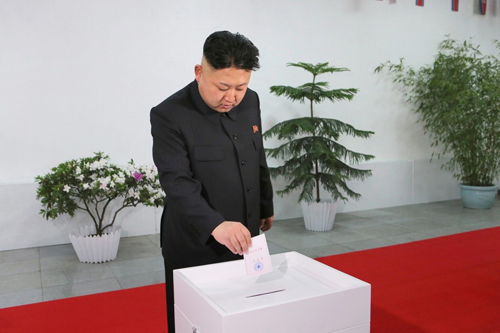 A picture released by the North Korea Central News Agency (KCNA) shows North Korean leader Kim Jong-un casting a ballot at a polling station. (Yonhap/KCNA)