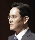 In this June 23, 2015, Lee Jae-yong, vice chairman of Samsung Electronics Co., arrives to attend a press conference at the company's headquarters in Seoul, South Korea. A vote on combining companies in the Samsung empire is pitting South Korea’s richest family against small shareholders and foreign investors. Shareholders at Samsung C&T will vote Friday, July 17 on the proposed takeover of the company by another Samsung company, Cheil Industries. (AP Photo/Ahn Young-joon)