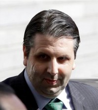 In this March 10, 2015, injured U.S. Ambassador to South Korea Mark Lippert leaves after being discharged from Seoul's Severance Hospital in Seoul, South Korea. South Korean police said Friday that they had arrested a 33-year-old jobless man for allegedly making an online threat to kill the U.S. ambassador in Seoul. The man allegedly left an English message vowing to "kill" Mark Lippert with "nuclear poisoning" on the website of the White House on July 8, police said in a statement. (AP Photo/Lee Jin-man)