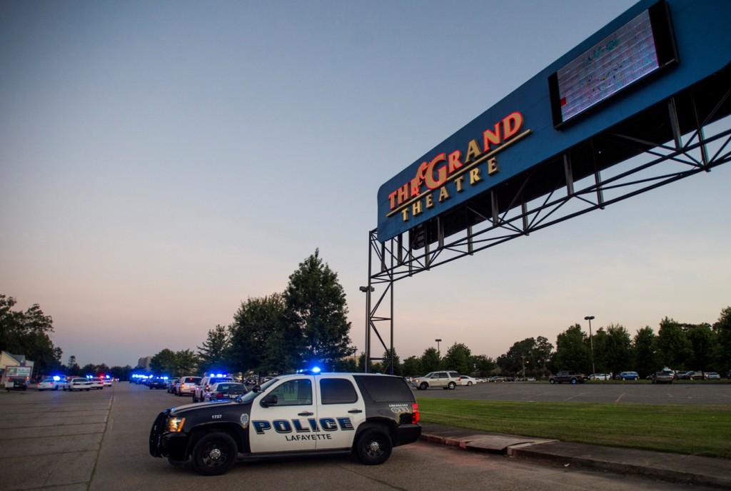 A Lafayette Police Department vehicle blocks an entrance at the Grand Theatre in Lafayette, La., following a shooting, Thursday, July 23, 2015. (Paul Kieu/The Daily Advertiser via AP)