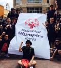 The South Korean Special Olympics team poses with Irvine Mayor Steven Choi after a welcome parade Wednesday afternoon outside Spectrum Center.