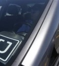 Uber driver Karim Amrani sits in his car parked near the San Francisco International Airport parking area in San Francisco, Wednesday, July 15, 2015. In the three months ended in June, Uber overtook taxis as the most expensed form of ground transportation, according to expense management system provider Certify. (AP Photo/Jeff Chiu)