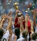 The United States Women's National Team celebrates with the trophy after they defeated Japan 5-2 in the FIFA Women's World Cup soccer championship in Vancouver, British Columbia, Canada, Sunday, July 5, 2015. (Darryl Dyck/The Canadian Press via AP)