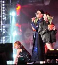 Comedian Park Myung-soo, left, performs with singer IU in the "Infinite Challenge" music festival aired on Saturday. (Yonhap)