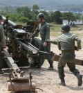 A South Korean Army artillery unit re-enacts firing artillery with an old-style cannon during a live-fire drill at a training range in the South Korean border city of Cherwon, north of Seoul, on June 24, 2015, one day ahead of the 65th anniversary of the start of the 1950-53 Korean War. This drill was aimed at remembering the battles against invading North Korean forces in the three-year conflict. (Yonhap)