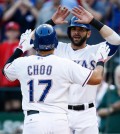 Texas Rangers' Shin-Soo Choo, left, is congratulated by Mitch Moreland, right, for his two run home run against the Houston Astros during the first inning of a baseball game, Monday, Aug. 3, 2015, in Arlington, Texas. (AP Photo/Jim Cowsert)